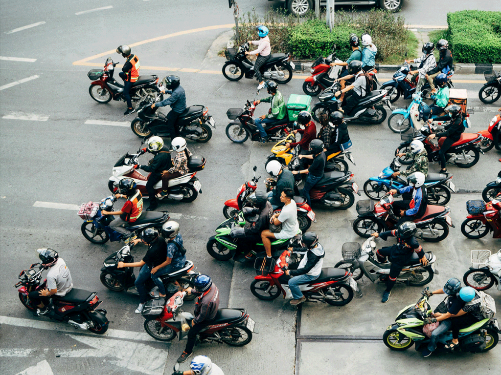 How to safely ride a motorcycle in Bangkok – motorbikes waiting for the traffic light.